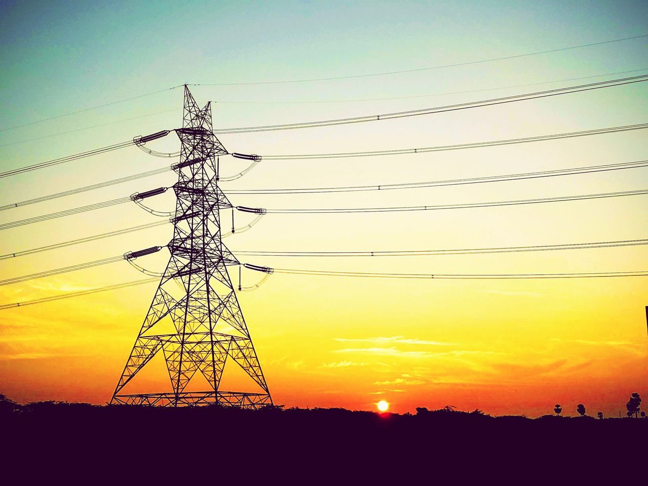 LOW ANGLE VIEW OF SILHOUETTE ELECTRICITY PYLONS AGAINST ROMANTIC SKY
