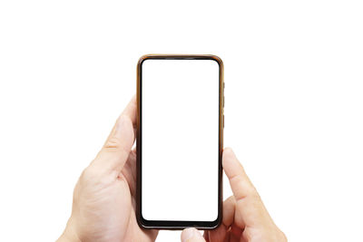 Midsection of person holding smart phone against white background