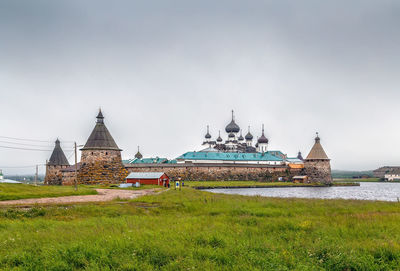 View of temple on building against sky