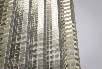 Low angle view of modern buildings against sky