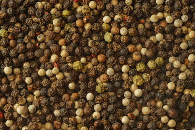 Mixed peppercorns background close-up