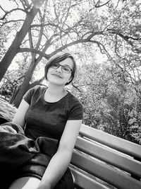 Portrait of a smiling young woman sitting outdoors