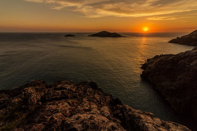 Scenic view of sea against sky during sunset