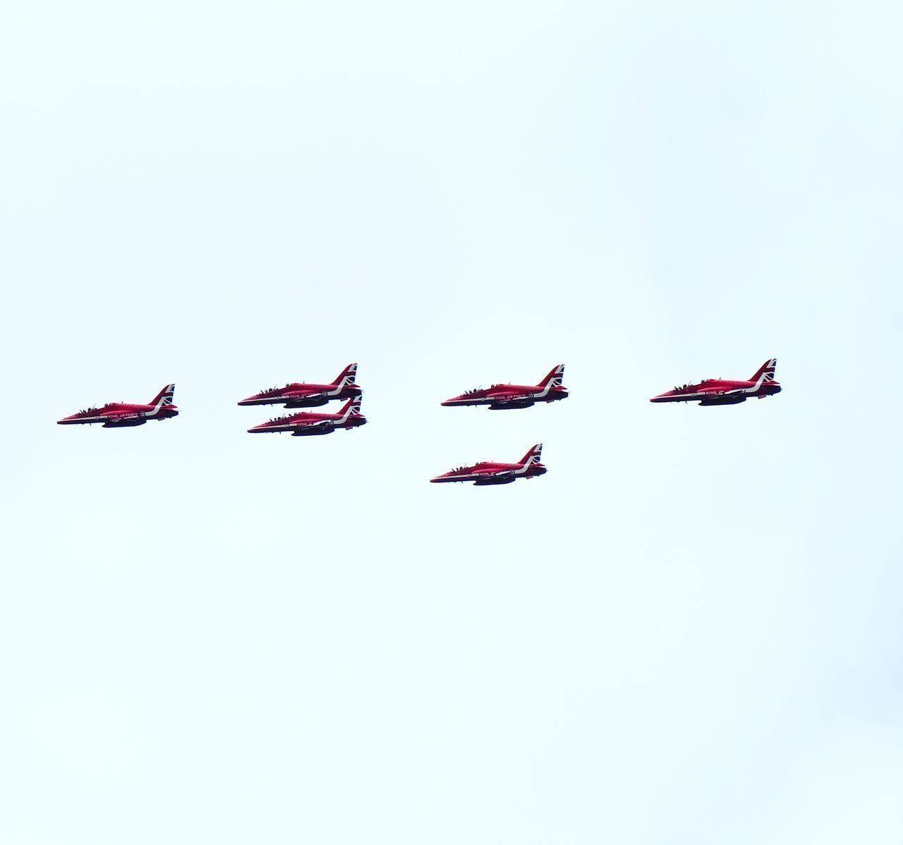 LOW ANGLE VIEW OF AIRPLANE FLYING IN SKY