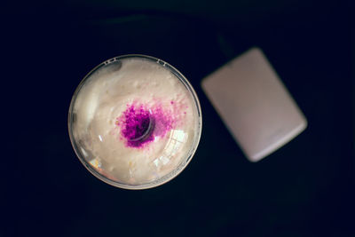 High angle view of ice cream against black background