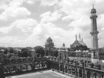 High angle view of bara imambara against cloudy sky