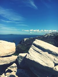 Scenic view of beach against blue sky