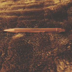 High angle view of cigarette on wood