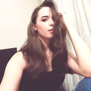 Portrait of young woman at home