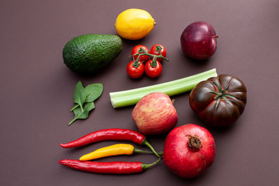 Fruits and vegetables on brown background