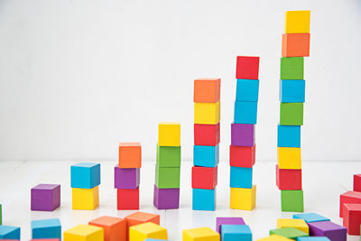 Close-up of multi colored toy blocks stacked on table