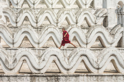 The young monk are running and jumping on the mya thein tan pagoda at bagan, mandal