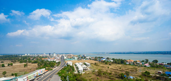 High angle view of road by buildings against sky