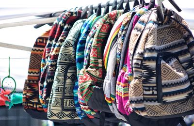 Close-up of clothes hanging in store for sale