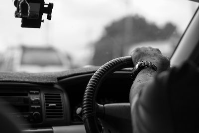 Close-up of man photographing car