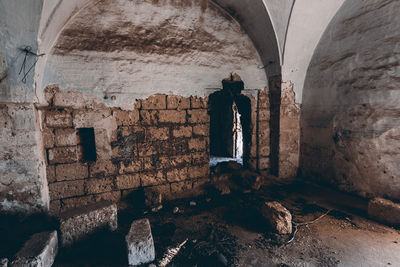 Rear view of man standing in tunnel