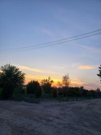 Scenic view of field against sky during sunset