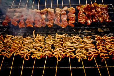 High angle view of meat cooking on barbecue grill