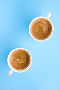 Directly above shot of coffee on blue background