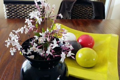 Close-up of flower vase on table at home