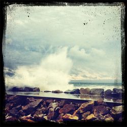 Scenic view of sea against cloudy sky