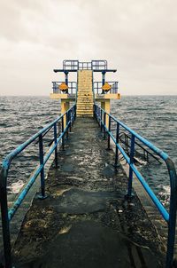 View of pier over sea against sky