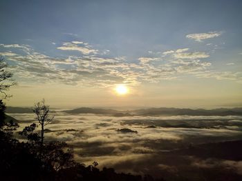 Scenic view of silhouette mountains against sky during sunset