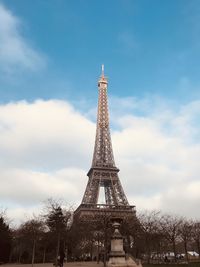 Low angle view of tower against cloudy sky