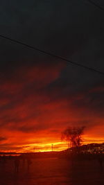 Scenic view of sea against orange sky