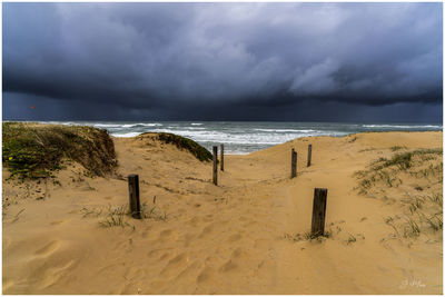 Scenic view of beach against sky