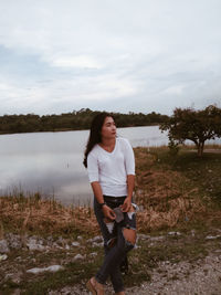 Full length of man standing on land against sky
