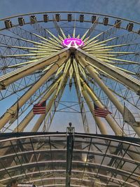 Low angle view of ferris wheel against sky