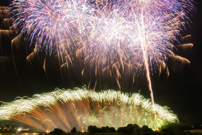 Firework display at night