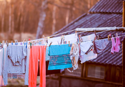 Close-up of clothes hanging on railing