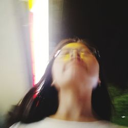 Close-up portrait of woman drinking from glass