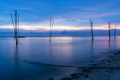 Scenic view of sea against sky at sunset