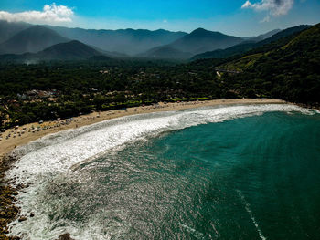 Scenic view of sea against mountains