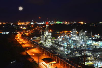 High angle view of illuminated buildings in city at night