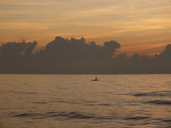 Silhouette of boats at sunset