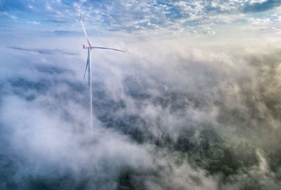 Germany, baden-wuerttemberg, schurwald, aerial view of wind wheel and morning fog