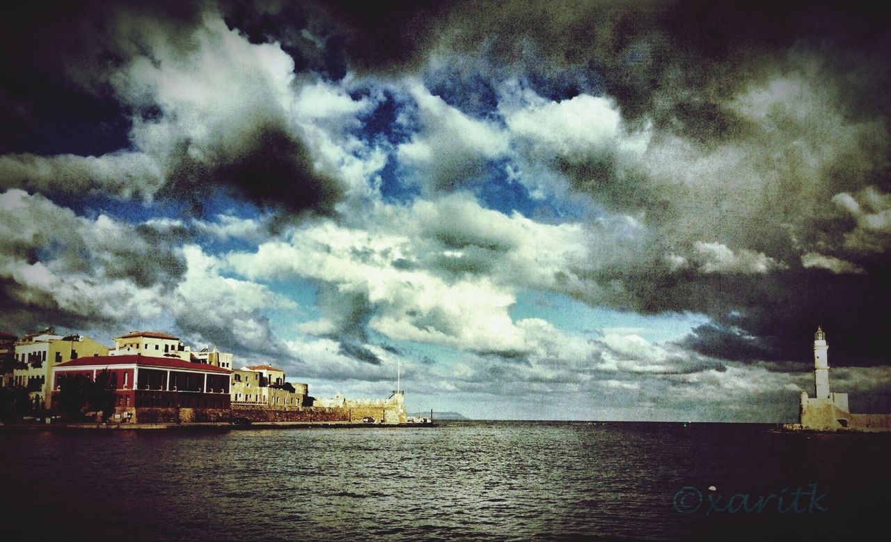 architecture, building exterior, built structure, water, sky, sea, waterfront, cloud - sky, cloudy, cloud, weather, nature, city, overcast, horizon over water, outdoors, dusk, house, storm cloud, building