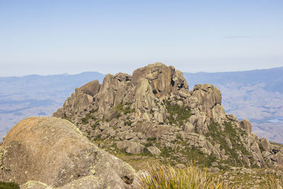 Rock formations on mountain against sky