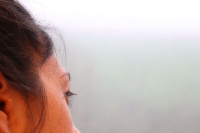 Cropped image of thoughtful woman outdoors