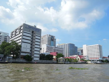 Modern buildings in city against sky