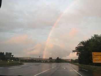 Rainbow over road