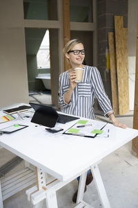 Young woman using laptop at office