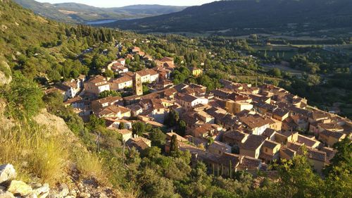 High angle view of houses in community with trees