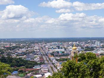 High angle view of buildings and sea against sky