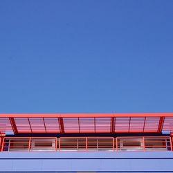 Low angle view of built structure against clear blue sky