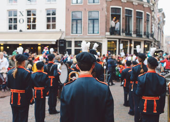 Rear view of men in city